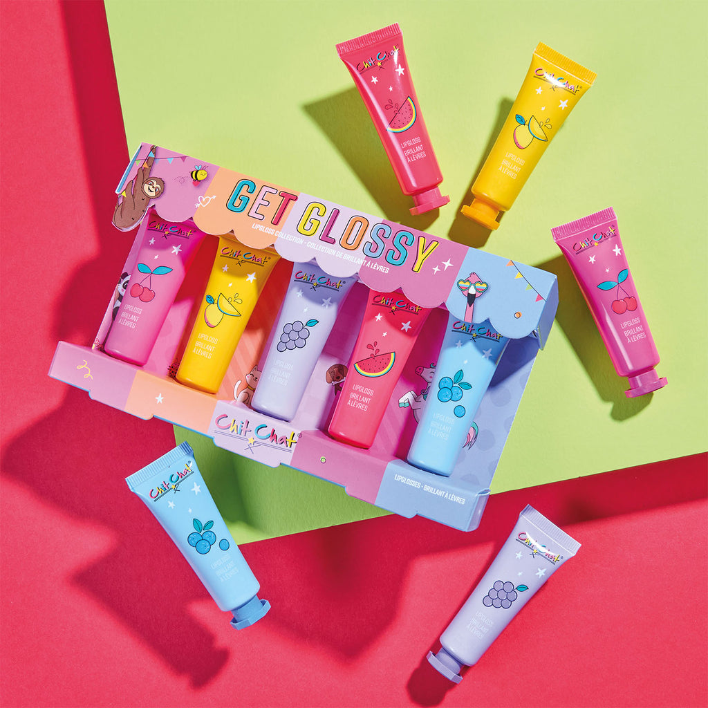 Colourful lip balm set with 'Get Glossy' packaging on a multicoloured background