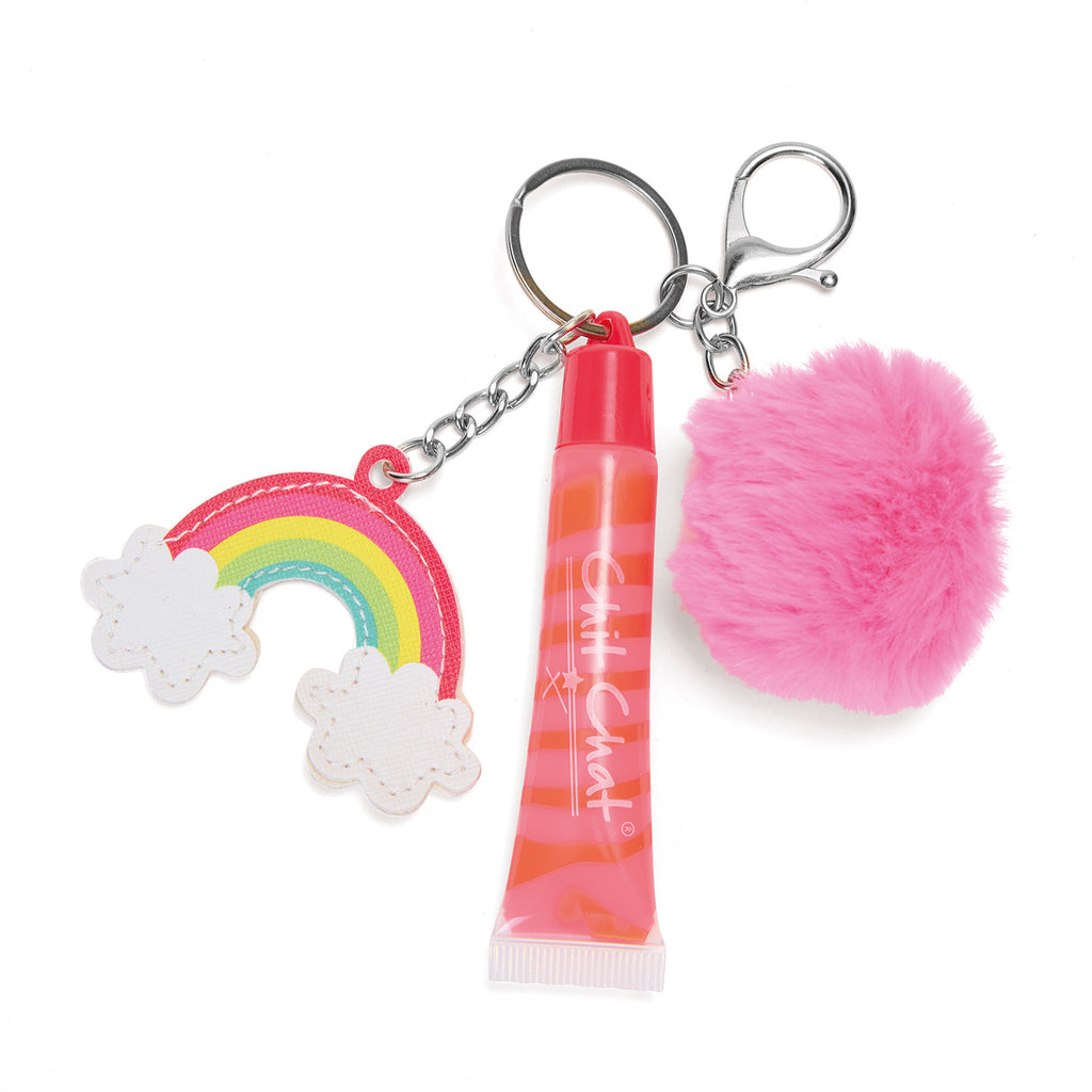 Keychain with rainbow charm, lip balm, and pink pom-pom on a white background