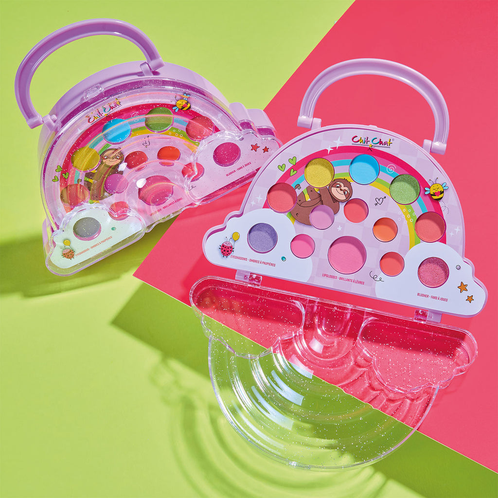 Rainbow shaped makeup palette with colourful shades on a pink and green background