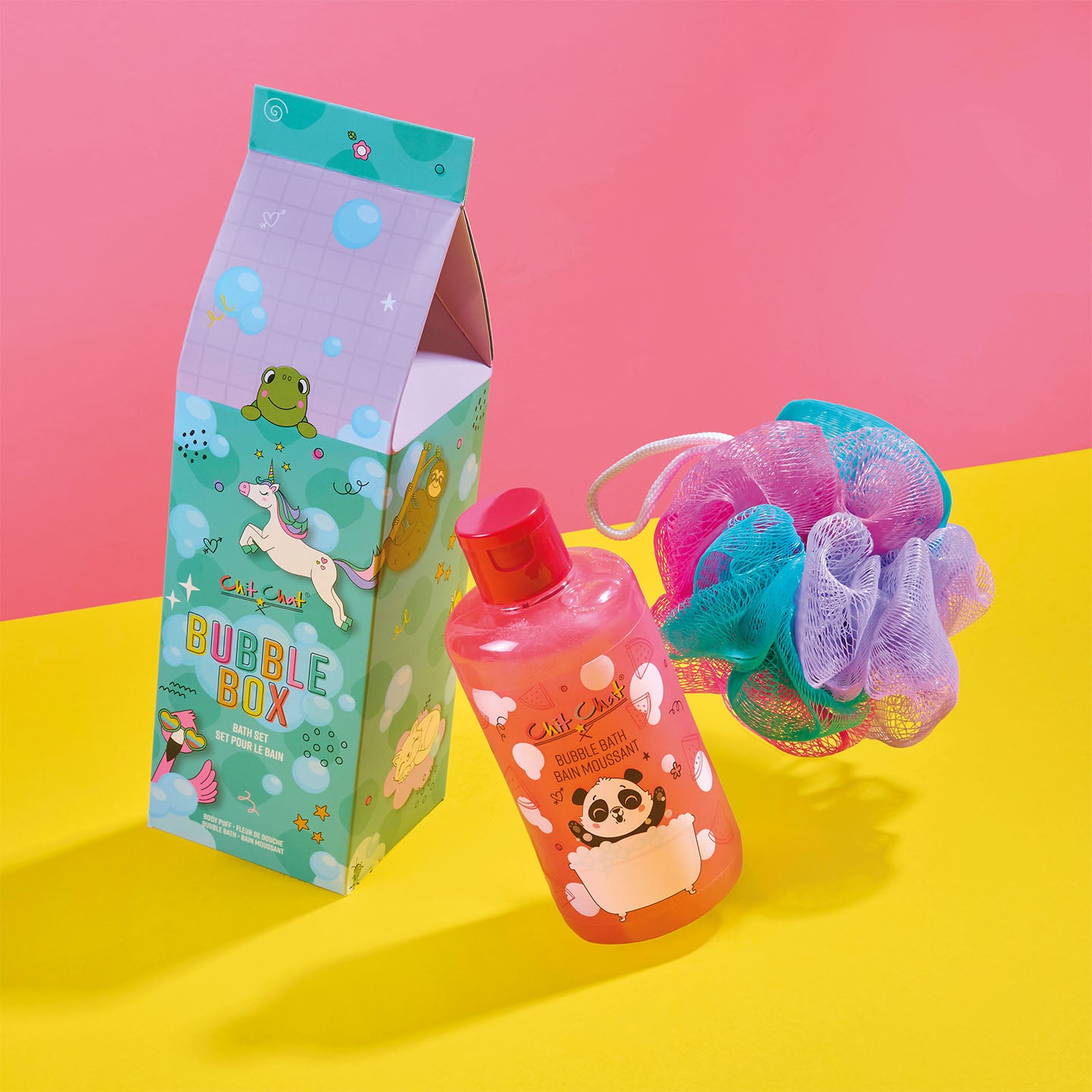 Bubble-themed product set with a box, bottle of bubble bath, and loofa on a pink and yellow background